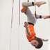 Boy on a static trapeze