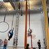 Adults on aerial hoops and silks at My Aerial Home